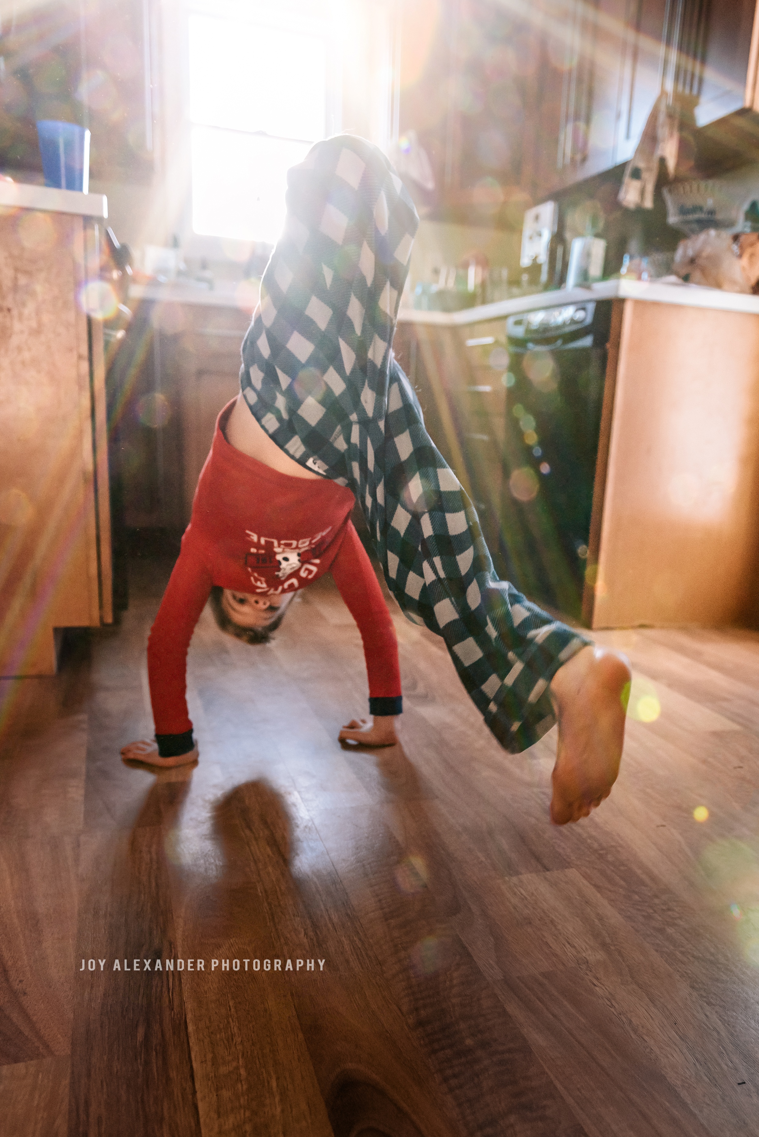 family photographer at home, in home photographer, New York photographer, boy breakdancing