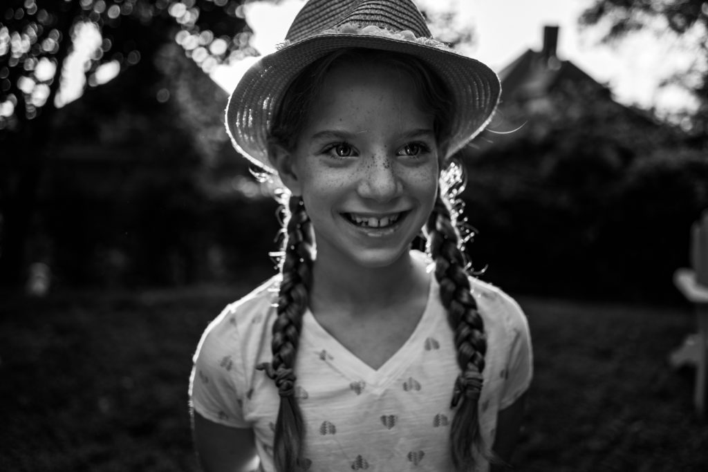 black and white photo, little girl with freckles